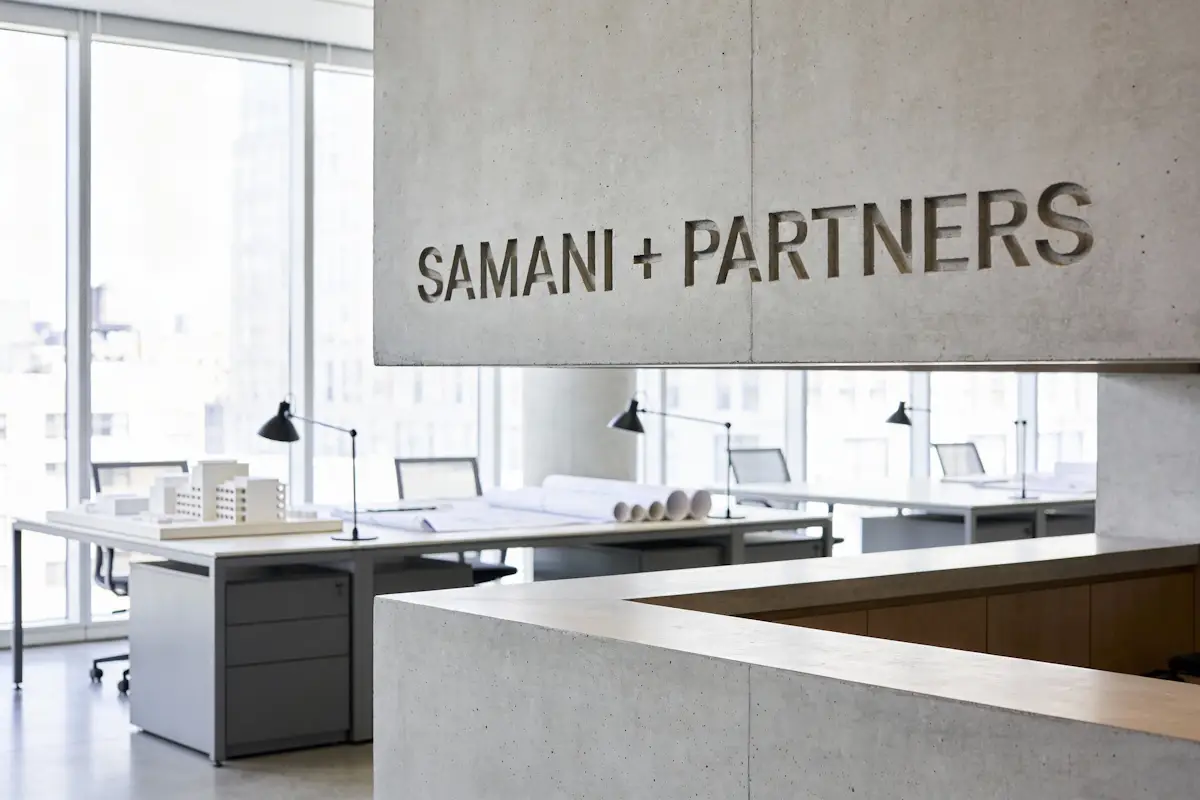 The Samani + Partners studio, its name lettered across a concrete wall